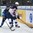 ZUG, SWITZERLAND - APRIL 26: USA's Jordan Greenway #12 shields the puck from Finland's Otto Leskinen #5 during gold medal game action at the 2015 IIHF Ice Hockey U18 World Championship. (Photo by Matt Zambonin/HHOF-IIHF Images)

